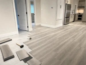 Luxury vinyl plank flooring installation in a Vancouver basement suite